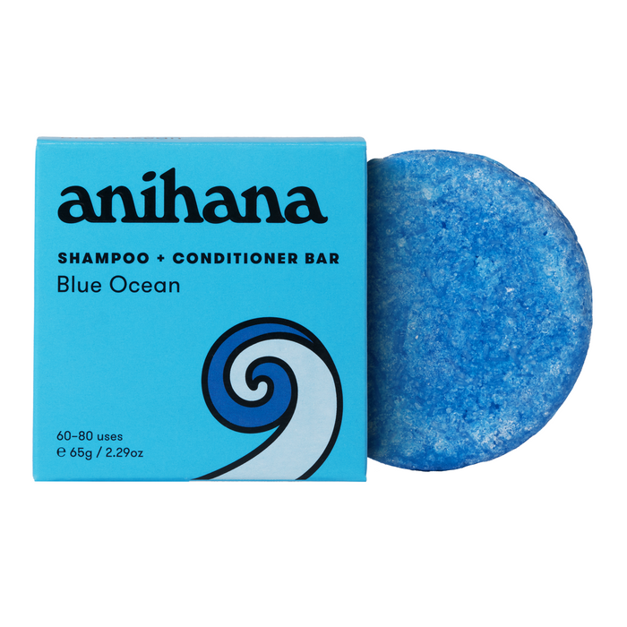 The Anihana 2 in 1 Shampoo & Conditioner Bar comes in a blue box and includes a round, textured bar with a wave design. This sustainable travel-friendly product offers 60-80 uses and weighs 65g / 2.29oz.