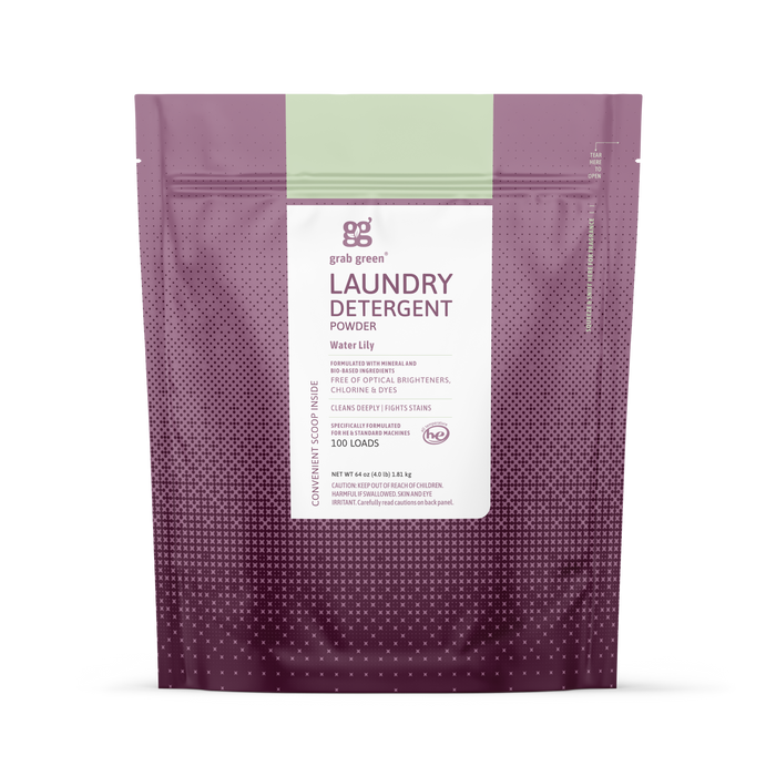 A purple and pink resealable bag of grab green 3 in 1 Laundry Detergent Powder in Water Lily scent for 100 loads, designed for high-efficiency machines, features product details on a white center panel.