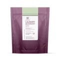 A purple and pink resealable bag of grab green 3 in 1 Laundry Detergent Powder in Water Lily scent for 100 loads, designed for high-efficiency machines, features product details on a white center panel.
