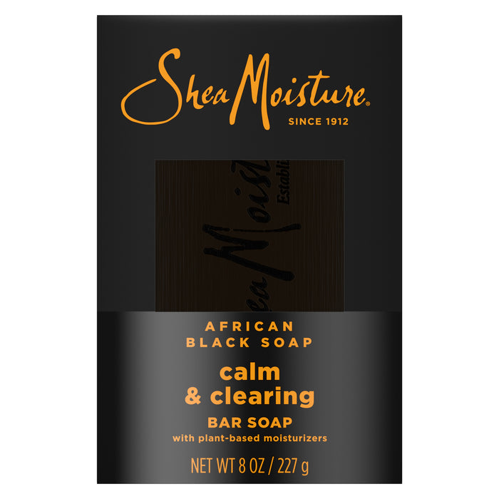 SheaMoisture African Black Soap Bar Soap with Shea Butter, packaged in black and gold, is labeled as a calm & clearing bar soap with plant-based moisturizers, created to help soothe eczema and psoriasis. Net weight: 8 oz (227 g).