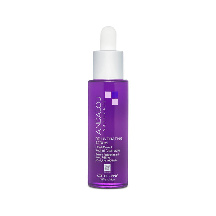 A purple bottle of Andalou Naturals Age Defying Rejuvenating Retinol Alternative Serum with a dropper top stands against a white background, labeled plant-based and featuring bakuchiol for anti-aging benefits as a retinol alternative.