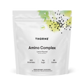 A white pouch of Thorne Amino Complex, Lemon Flavored, features artistic green and black splashes, a 2:1:1 BCAA ratio, 0g sugar, 25 calories, and 30 stick packs to help support muscle strength and lean muscle mass.