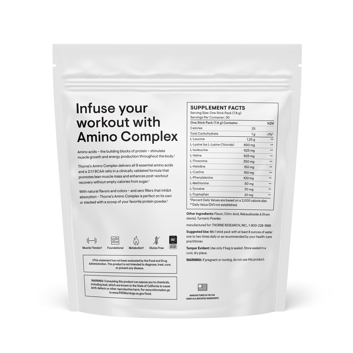 A white resealable pouch labeled Thorne Amino Complex has its back facing forward, displaying supplement facts, ingredients, and usage instructions for an amino acids and BCAA formula.
