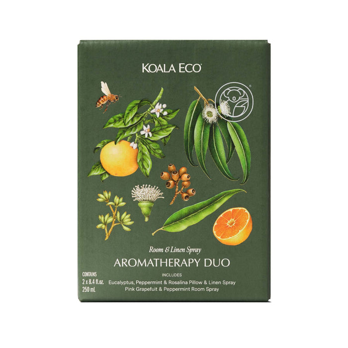 A green box of Koala Eco Aromatherapy Duo features eucalyptus, blossoms, citrus botanicals, a bee on the front, and contains two 250ml pillow & linen spray bottles.
