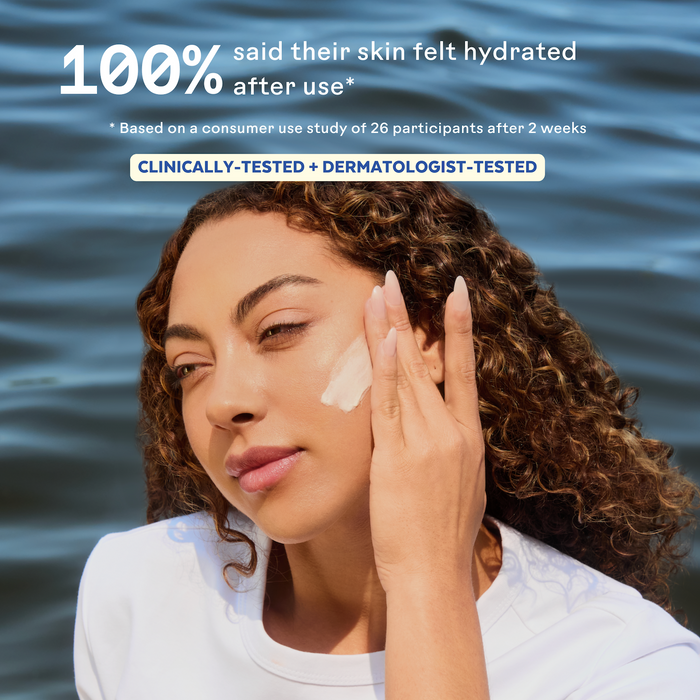 A woman applies cream outdoors, highlighting Three Ships’ Best-Sellers Discovery Kit. Text: 100% said skin felt hydrated after use in a two-week consumer study and clinical testing. All-natural skincare for radiant results.