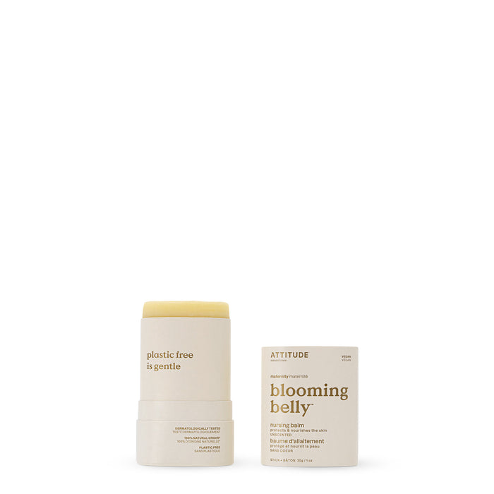 A cylindrical tube of ATTITUDE blooming belly Nursing Balm stands open beside its matching box. The tube reads “plastic free” and is gentle for sensitive skin. The white box features gold and brown text.
