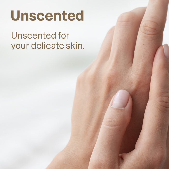 Close-up of two hands with clean, natural nails gently touching. Text: ATTITUDE blooming belly Nursing Balm—unscented, gentle care in zero-plastic packaging for delicate skin. Soft, blurred background.