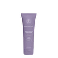 The Innersense Organic Beauty Bright Balance Conditioner - Travel Size has a purple tube with the brand logo and text, “A violet toning conditioner to neutralize brass and “Lift-après-shampooing tonifiant. This 2 fl. oz. (59 mL) container features a silicone-free formula for balanced care.