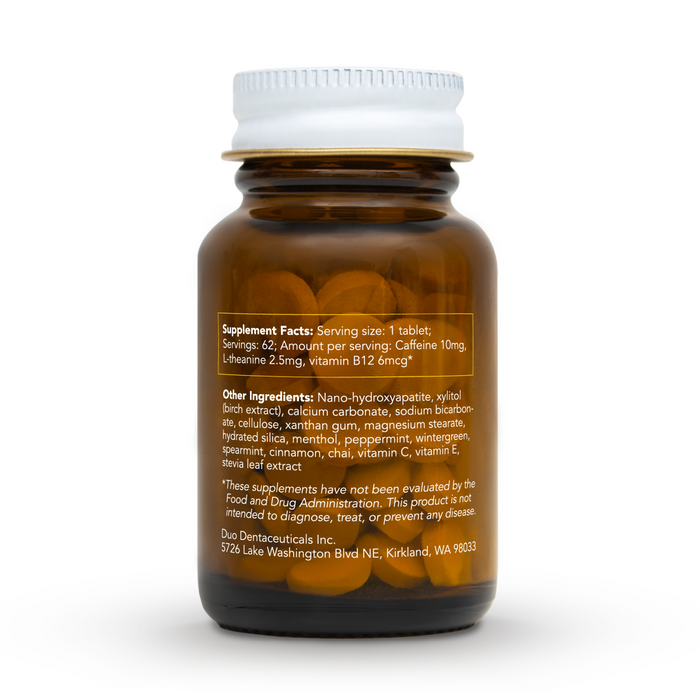 A brown glass bottle labeled with supplement facts lists ingredients such as caffeine, L-theanine, and vitamin B12. It includes manufacturer details and an FDA evaluation disclaimer. This duo Toothpaste product, Caffeine + B12 Toothpaste Tablets, supports enhanced vitamin B12 absorption.