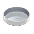 A 9 Circle Cake Pan in grey, featuring a smooth ceramic coating with Caraway branded on the bottom interior. It has a glossy, modern design and a reliable non-stick surface for easy baking.