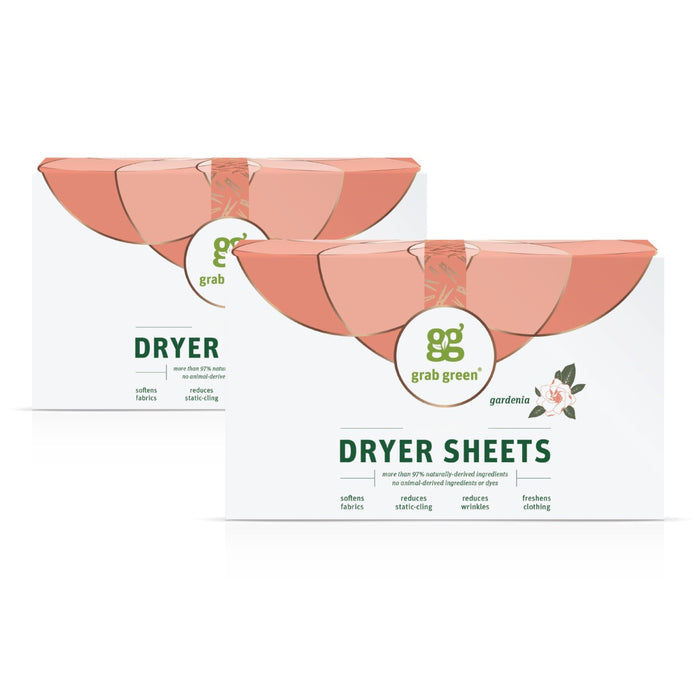 Two boxes of grab green Classic Dryer Sheets - Gardenia are shown with a white background, orange leaf details, and floral art. The packaging highlights their fabric-softening and static-reducing benefits.