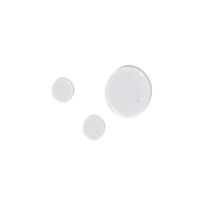 Three clear, glossy bubbles of varying sizes float against a white background, reflecting the pure and gentle nature of Terra Beauty Bars sulfate-free Curl+ Shampoo. Light beautifully highlights their glossy surfaces.