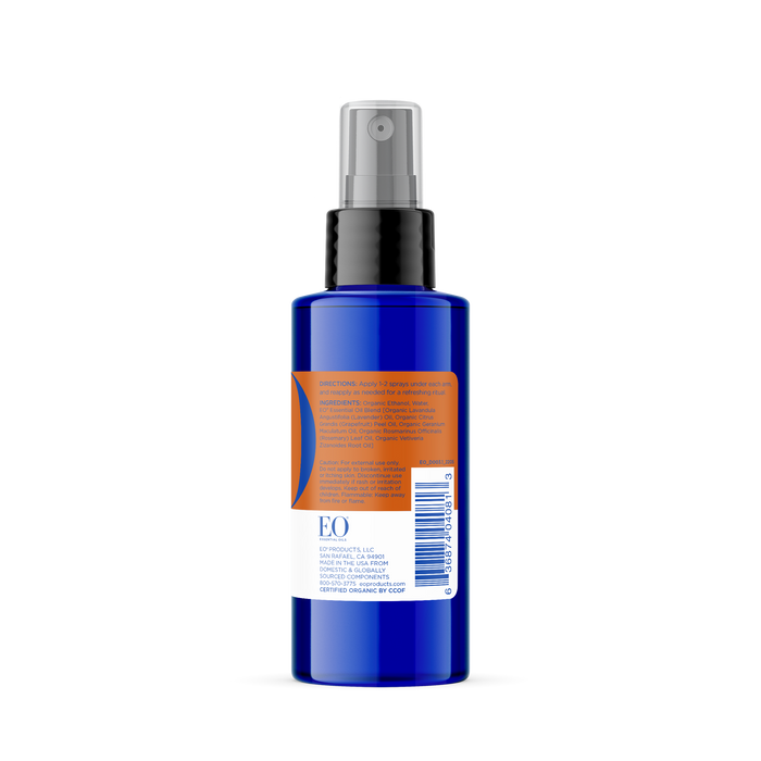 A blue spray bottle with a black nozzle and orange label hints at its French Lavender scent. The EO Products Deodorant Spray label details directions, ingredients, and includes a barcode on a crisp white background.