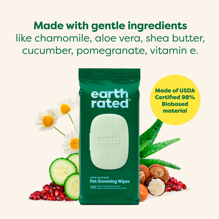 Earth Rated Dog Grooming Wipes – Extra Thick, White Tea Basil Scented, are shown with chamomile, aloe vera, shea butter, cucumber slices, pomegranate seeds, and vitamin E. Text highlights gentle natural ingredients and USDA certification.