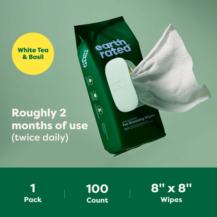 A pack of Earth Rated Dog Grooming Wipes – Extra Thick, White Tea Basil Scented (100 wipes, 8x8), with one wipe being pulled out. Text notes ~2 months of use (twice daily), 1 pack included.