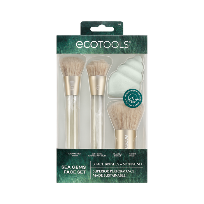 The EcoTools Eco Sea Gems Face Set includes vegan brushes with wood-style handles and a sponge, highlighted by light bristles. The packaging emphasizes its eco-friendly, cruelty-free nature and sustainable performance.