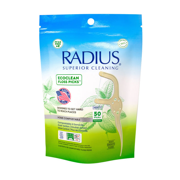 A 50-count pack of Radius EcoClean Floss Picks with Toothpick End in mint flavor features green leaves and product info. These sustainable, home-compostable picks offer a dual-function design for eco-friendly oral care.