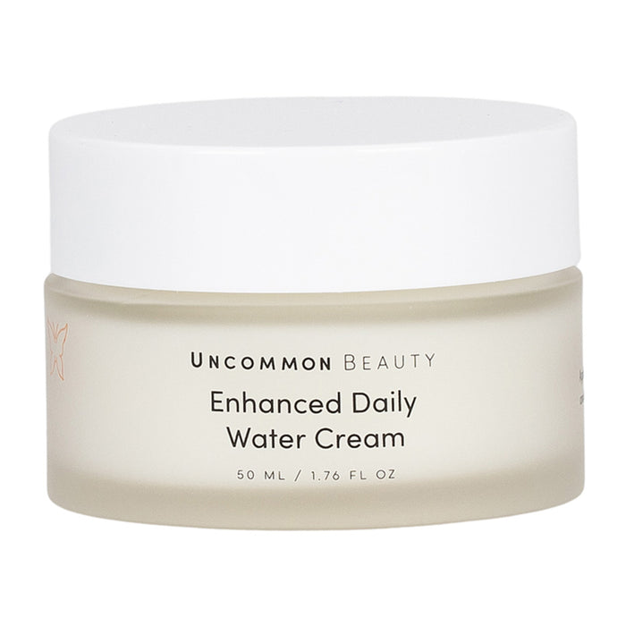 Uncommon Beauty Enhanced Daily Water Cream comes in a 50 ml frosted jar with a white lid. This lightweight moisturizer hydrates and supports your skin barrier for a radiant complexion.