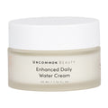 Uncommon Beauty Enhanced Daily Water Cream comes in a 50 ml frosted jar with a white lid. This lightweight moisturizer hydrates and supports your skin barrier for a radiant complexion.