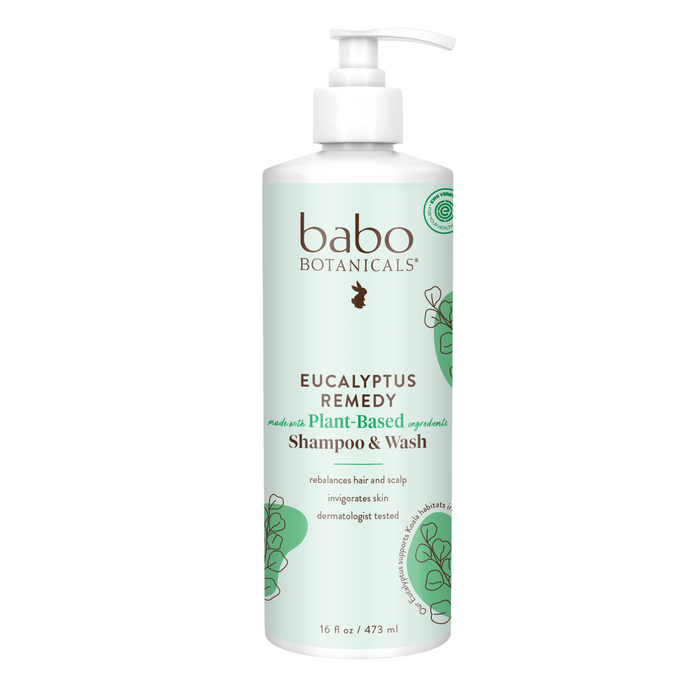 A white pump bottle of Babo Botanicals Eucalyptus Remedy Shampoo & Wash features green accents, botanical illustrations, and is labeled for rebalancing hair and scalp with sustainably sourced eucalyptus oil; dermatologically tested.