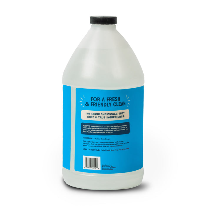 Aunt Fannies Extra Strength Cleaning Vinegar Refill comes in a large plastic bottle with a blue label stating “For a Fresh & Friendly Clean.” The label highlights no harsh chemicals and lists distilled white vinegar as the main ingredient. Black cap included.