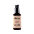 The Thrive Natural Care Face Balm, in a brown bottle with a black pump, is a 2 fl oz (60 ml) moisturizer enriched with plant extracts to moisturize, restore, and calm irritation for all skin types. It features eco-friendly recycled materials and is lightweight in texture.