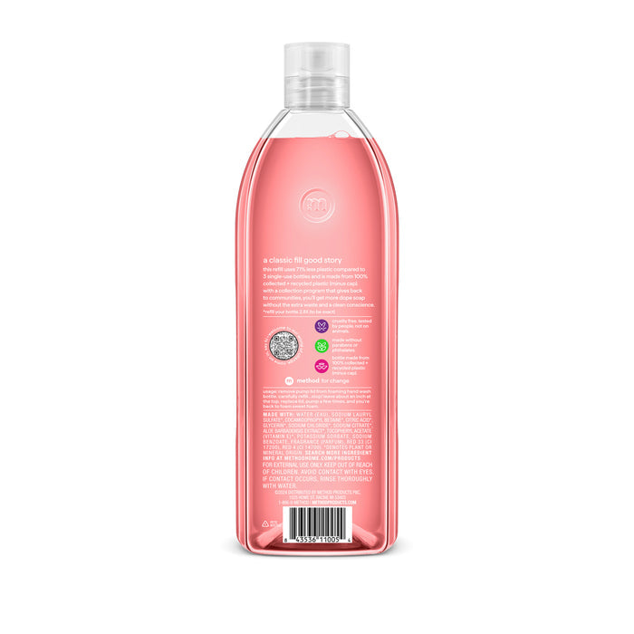 A clear recycled plastic bottle with pink liquid, shown from the back. The label has text, colored circles, a barcode, and instructions. This is a method Foaming Hand Soap Refill in Pink Grapefruit with a silver cap and a slight curve.