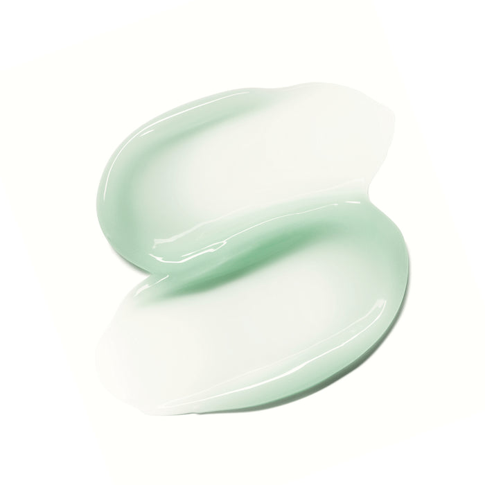 A smear of Ursa Majors Forest Water Hyaluronic Serum, light green and glossy on a white background, looks smooth and hydrated. Enriched with Hyaluronic Acid, it promises relief for dehydrated skin with its soft texture and gentle shine.