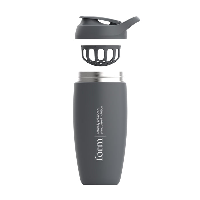 The Form Insulated Shaker Bottle by Form Nutrition is a gray stainless steel bottle featuring a textured grip, strainer insert, and flip-top lid, ideal for drinks like protein shakes or smoothies.