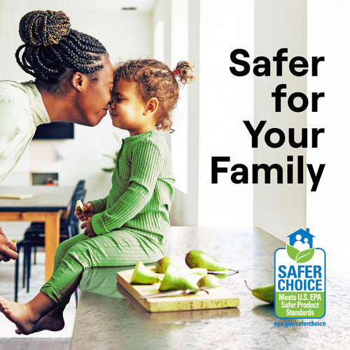 A woman gently touches her nose to a young childs in a bright kitchen. The child sits near pears and Seventh Generation Granite & Stone Cleaner. Text reads Safer for Your Family with the Safer Choice certification logo shown.