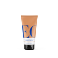 A tan tube of EO Products Hand Cream, featuring hyaluronic acid, stands upright with bold blue letters EO and smaller text for the scent: uplifting orange blossom vanilla. The tube size is 2.5 oz / 74 mL.