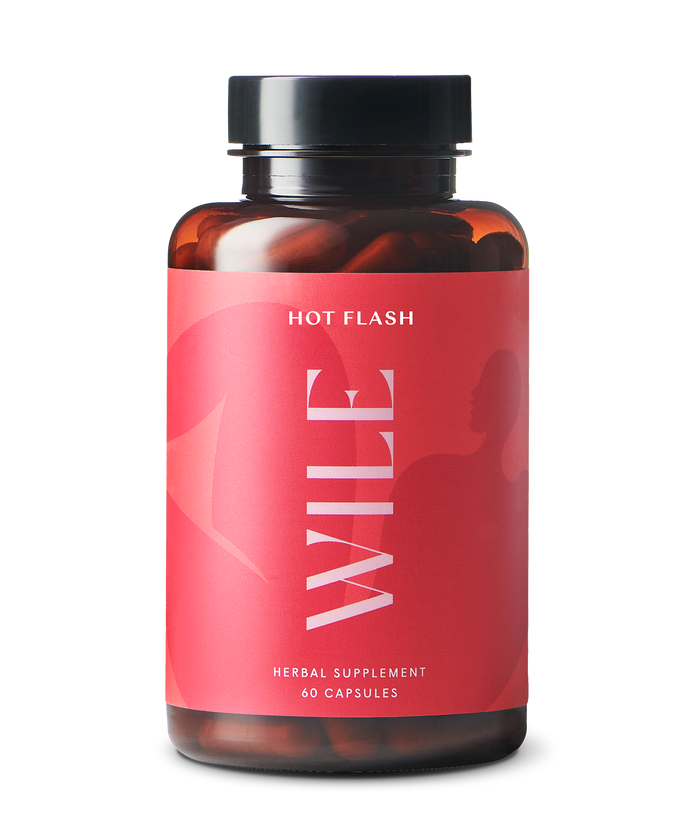 A WILE Herbal Supplement bottle for hormonal wellness has a red Hot Flash label, 60 capsules, and a black cap, designed to effectively manage hot flashes.