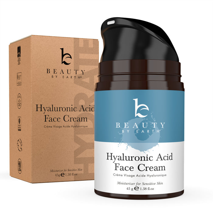 The Beauty by Earth Hyaluronic Acid Cream, a potent anti-wrinkle solution for sensitive skin, sits alongside its cardboard box. The black bottle showcases white and teal labels and contains 45g (1.58 fl oz) of hydrating cream.
