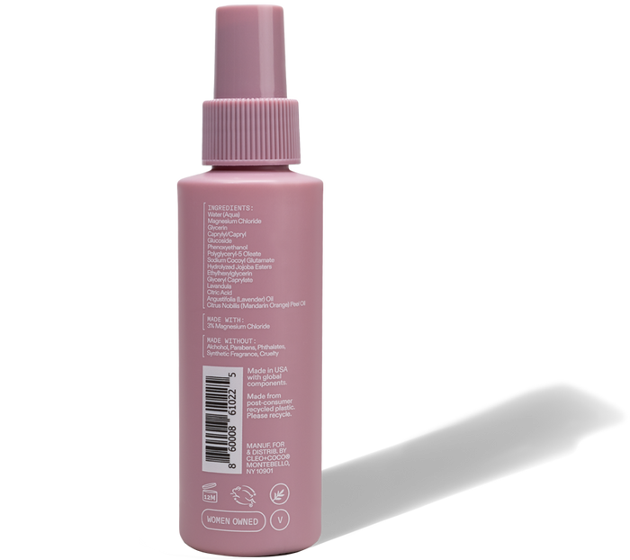 A pink Cleo & Coco Magnesium Spray bottle features labeled ingredients, a matching cap, and symbols for women-owned, cruelty-free, recyclable status, and essential minerals for odor protection.