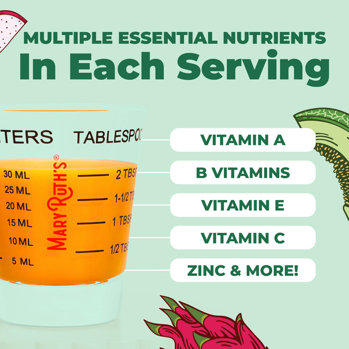 A measuring glass with orange liquid sits beside text listing nutrients like Vitamin A, B Vitamins, Vitamin E, Zinc, and more. The green background shows illustrated fruits and vegetables for hair thickness. Product: MaryRuth's Morning Multivitamin + Hair Growth Liquid.