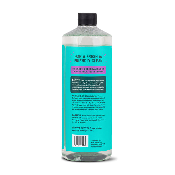 Aunt Fannies Multi-Surface Floor Cleaner features a turquoise label with a vinegar-powered formula. The label details usage instructions, ingredients, recyclable info, and emphasizes plant-based surfactants and no harsh chemicals for a natural solution.