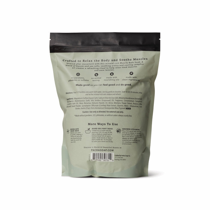 Back view of a green Pacha Soap Co. Muscle Epsom Salt Soak bag with white text showing product info, directions, and tips to relax tired muscles. The resealable bag stands upright on a white background.
