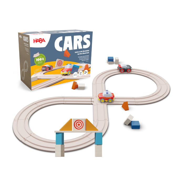 The HABA My First Racetrack is a figure-eight track for ages 2+, made from 100% recycled materials. It features colorful toy cars, geometric shapes, a gate, and comes in a box labeled HABA CARS for creative play.