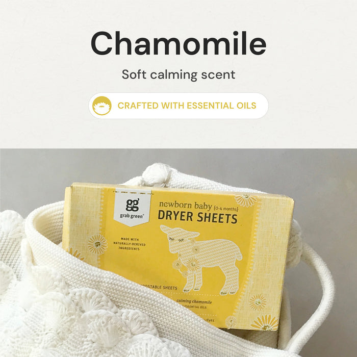 A package of grab green Newborn Baby Dryer Sheets - Chamomile, designed to soften fabrics and reduce static cling, is partially tucked into a textured white blanket. The packaging showcases a simple sheep illustration and highlights its natural essential oil formulation, ideal for newborns.