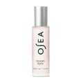 The OSEA Ocean Eyes® Age-Defying Eye Serum, in a frosted glass bottle with ocean eyes text, combats puffiness and dark circles. Its minimalistic design includes a silver cap and contains 0.58 fl. oz. (16.5 ml) of hydrating gel serum for rejuvenation.