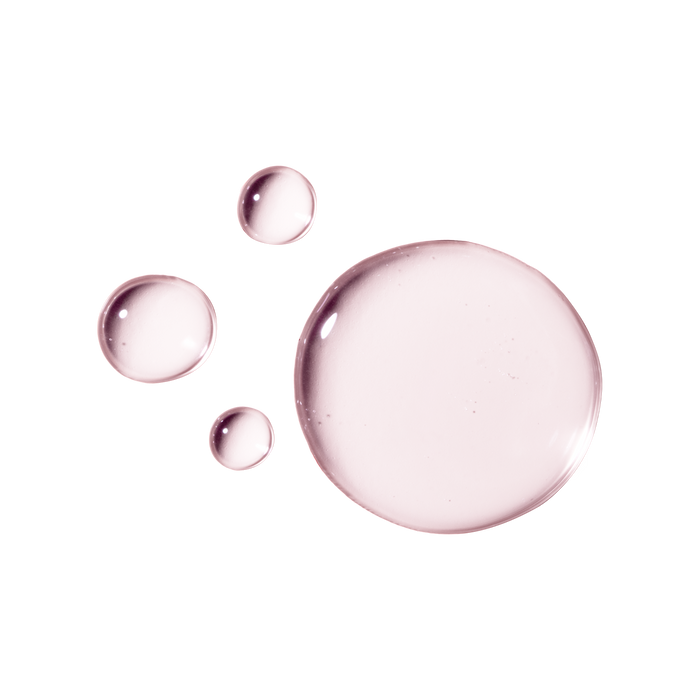 Four translucent, pinkish liquid droplets of varying sizes on a white background resemble bubbles. This OSEA Ocean Eyes® Age-Defying Eye Serum hydrates to reduce puffiness and dark circles, leaving your skin refreshed and revitalized.