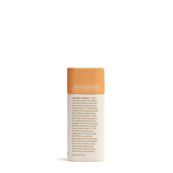 ATTITUDE Oceanly Bronzer features a cylindrical container with an orange cap and a beige label listing ingredients in small text. The label highlights 99.9% natural origin. It delivers a golden, natural-looking color, shown on a plain white background.