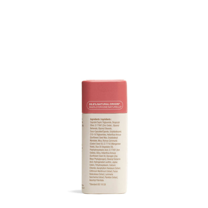 The ATTITUDE Oceanly Cheeks Blush comes in a beige cylindrical tube with a pink cap, marked 98.6% natural origin in English and French. This vegan, cruelty-free blush delivers a natural glow.