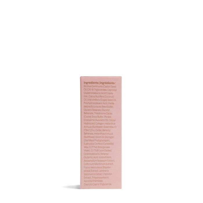 A pink rectangular box of ATTITUDE Oceanly Lip Gloss stands upright on a white background, displaying a list of naturally sourced ingredients printed in small text on one side.
