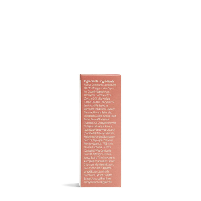 A pink Oceanly Lip Gloss box by ATTITUDE stands upright on a plain white background, displaying a list of naturally sourced ingredients in white text on one side.