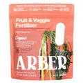 Arbers Organic Fruit & Veggie Fertilizer, in a pink 3 lb package featuring carrots, offers an organic blend with biochar for enhanced soil health. Perfect for tomatoes, peppers, and carrots, it nourishes up to 30 plants efficiently.