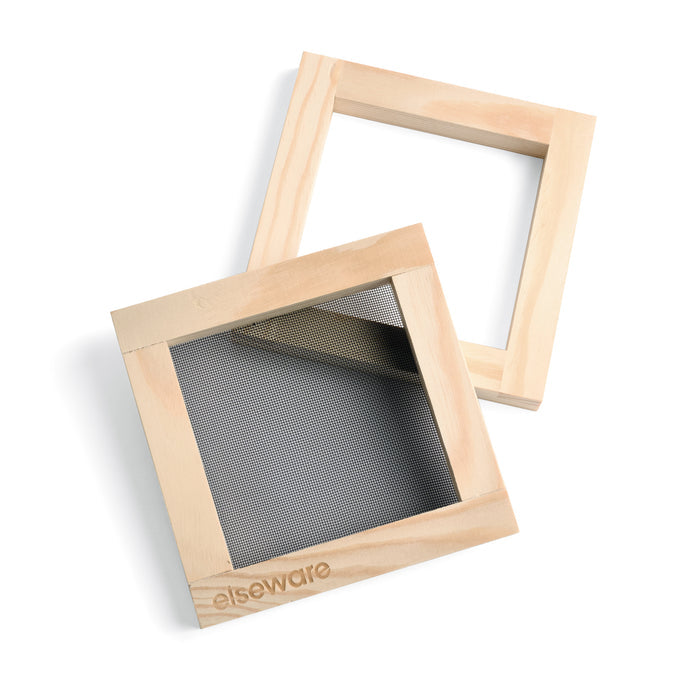 Two wooden frames with mesh screens, one partially covering the other on a white background. Engraved with Elseware, these frames are components of the Elseware Unplug Paper Making Kit, ideal for crafted pieces using recycled materials.