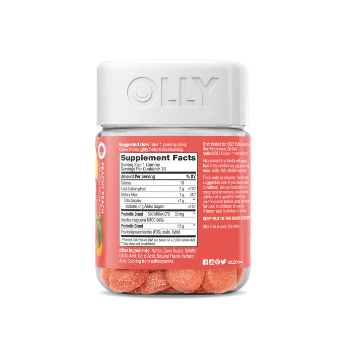 A clear jar of OLLY Probiotic + Prebiotic gummies has an orange cap with a red label showing supplement details and branding. Inside, you can see orange gummies enriched with Prebiotic Fiber for digestive health at the bottom.