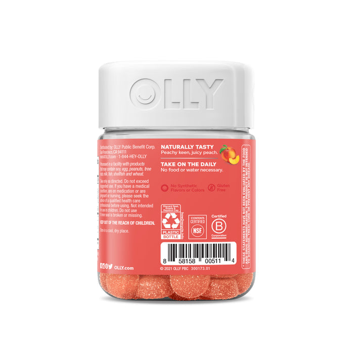 A clear jar with a white lid labeled OLLY Probiotic + Prebiotic holds peach-colored gummies for digestive health. The label notes features such as no synthetic colors, gluten-free, probiotic content, third-party testing, and advises keeping out of childrens reach.