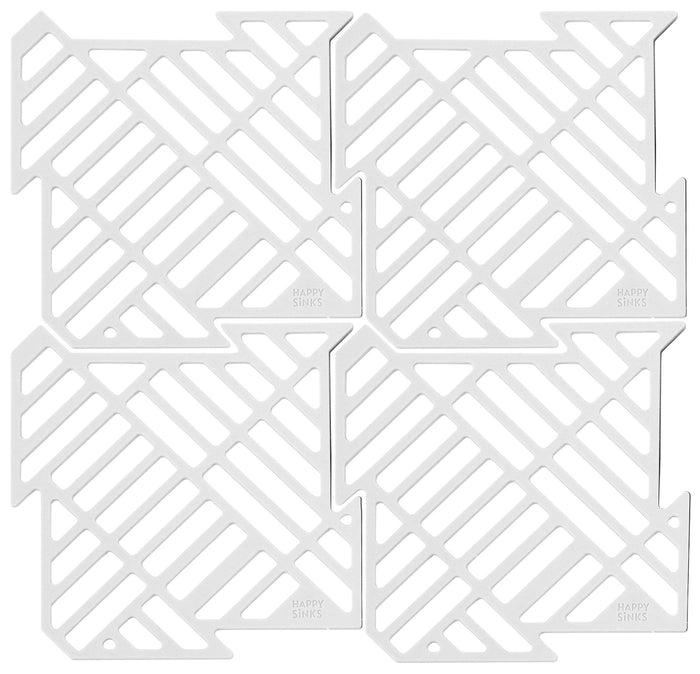 Four white square silicone Puzzle Sink Mats from HAPPY SiNKS are arranged into a larger square. Made of food-grade silicone, each mat has a diagonal grid pattern and is marked with Happy Sinks in the corner—ideal for a tidy kitchen.